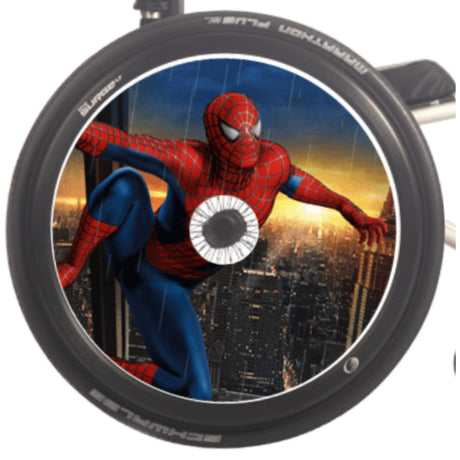 A round disc with a hole in the center features a cute, furry blue monster with big eyes, open mouth, sharp teeth, and its tongue sticking out, raising both arms.